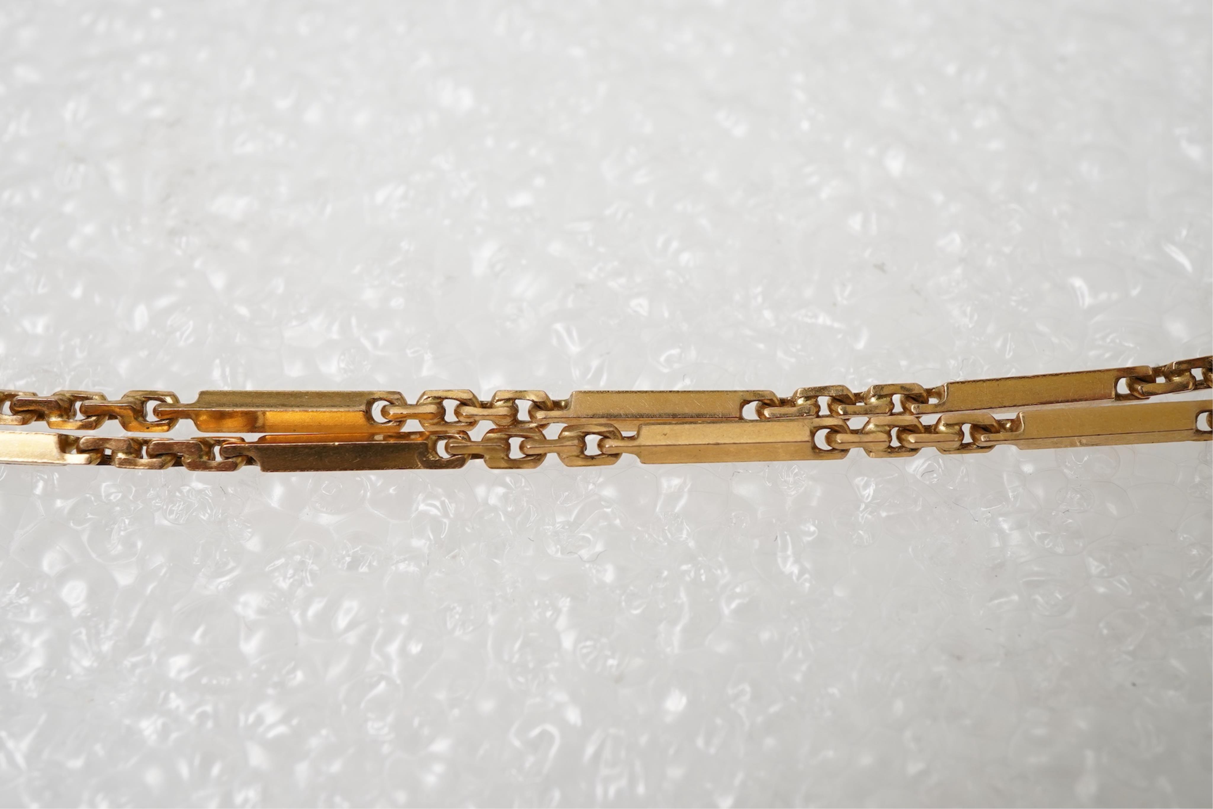 A gold zodiac pendant, mid 20th century